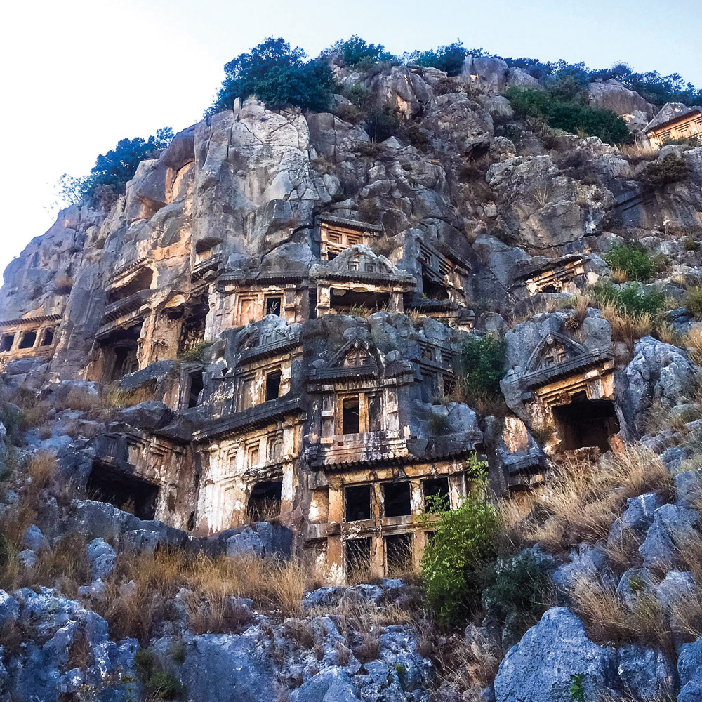 The majestic Lycian tombs carved into rocks on the mountainside.