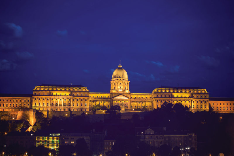 The glittering Parliament building appears to be floating on Danube